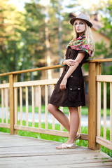 Young woman on small wooden bridge