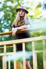 Young woman on small wooden bridge