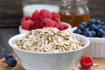 fresh foods for a healthy breakfast on dark wooden background