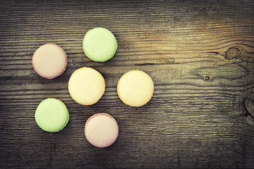 French macarons on  old wooden background