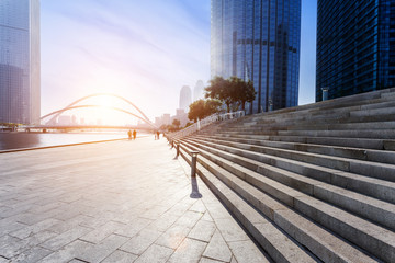 Modern skyline and empty road floor - Powered by Adobe