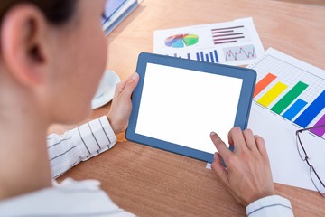 Fototapeta na wymiar Businesswoman using her digital tablet