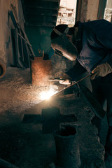 Welding steel. Welder worker works.