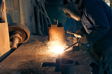 Welding steel. Welder worker works.