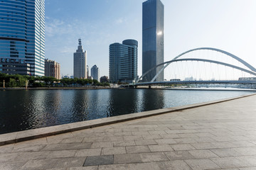 Fototapeta premium Modern skyline and empty road floor