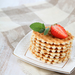 Waffles and ripe strawberries.