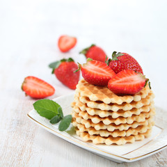 Waffles and ripe strawberries.