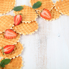 Waffles and ripe strawberries.