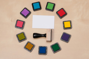 Rubber Stamp, Set Of Ink Pads And White Blank Business Card On W