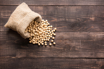 Top view soybean on wooden background and empty space
