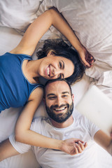 Young man and woman in bed