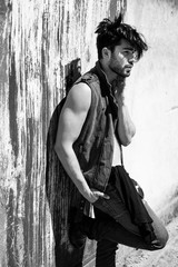 handsome man model dressed punk, hipster posing dramatic 