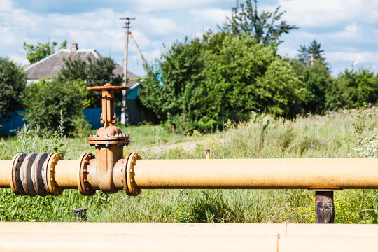 gas pipeline in village in summer day