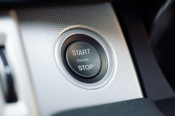 Car engine start and stop button on a hybrid electric car