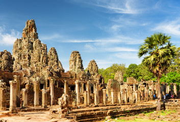 Main view of ancient Bayon temple in Angkor Thom in evening sun