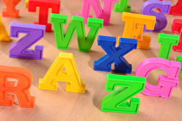 Plastic colorful alphabet letters close up