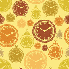 Naklejka premium Vintage wall clocks and alarm clocks, seamless gold background
