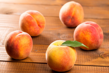 Fototapeta na wymiar Peach on wood background