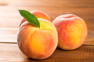 Peach on wood background