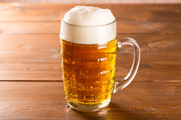 Beer mug on rustic wooden table