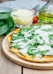 Homemade cheese spinach pizza