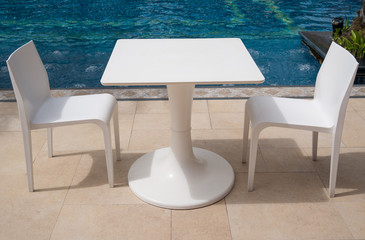 Table and Chair near swimming pool