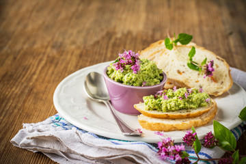 Green hot sauce made with fresh garlic arrows,  nuts and butter