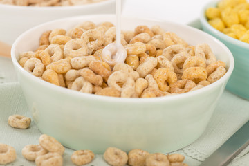 Cheerios - Bowl with cheerios whole grain cereals.
