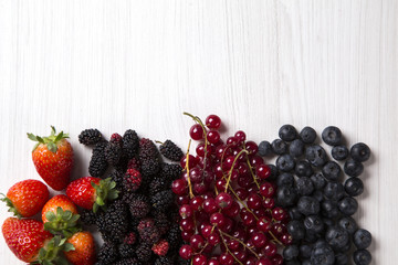 Some gooseberries, raspberries, strawberries and blueberries ove