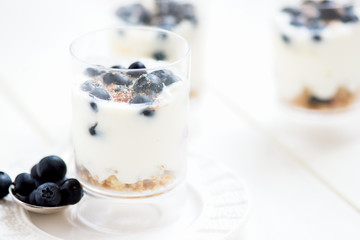 Delicious blueberries, greek yogurt and granola parfaits