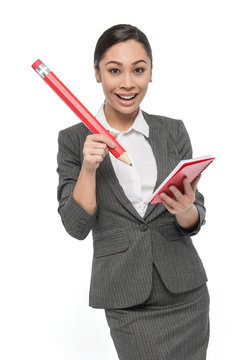 Happy Girl in Grey Suit with Giant Pencil And Pad Of Paper.