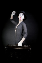 woman  mime in  hat with  suitcase