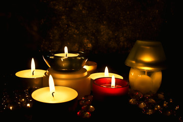 Group of candles against a dark background
