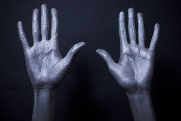  beautiful male hands in silver paint