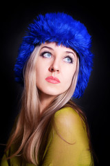beautiful young woman in blue winter hat