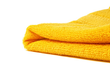Fototapeta na wymiar One yellow terry towel closeup