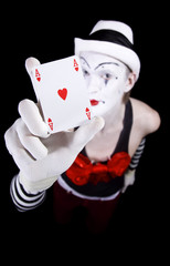 Mime in white hat showing ace of hearts