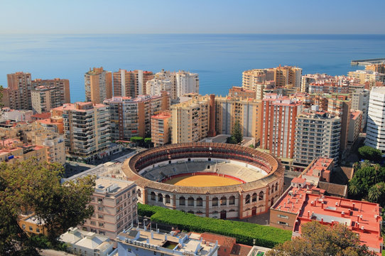 Arena for bullfight in city on sea coast. Malaga, Spain