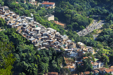 Fototapeta na wymiar Traffic Next to Favela (Shanty Town) in Rio de Janeiro, Brazil