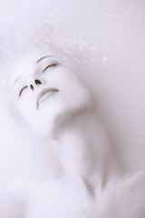 Face beautiful young woman in troubled waters