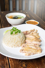 hainanese boiled chicken rice on the wooden table
