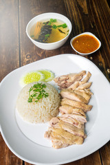 hainanese boiled chicken rice on the wooden table