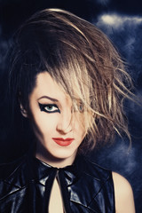 Portrait of beautiful young woman with bright makeup