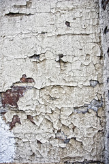 brick wall with  layer of the old cracked paint