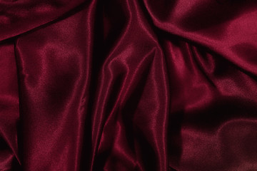 Texture of burgundy satin silk