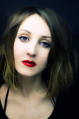 Fototapeta premium Portrait of the young beauty with violet eyes