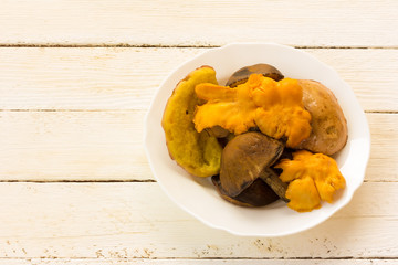 wild mushrooms/ raw edible forest mushrooms in the dish
