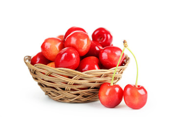 Ripe cherry in basket isolated on white