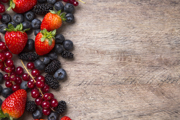 Some gooseberries, raspberries, strawberries and blueberries ove