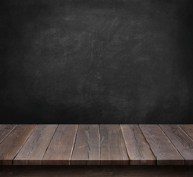 Wood table with blackboard background